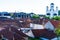 Overview of tile rooftops of old houses. Old buildings architecture