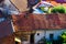 Overview of tile rooftops of old houses. Old buildings architecture