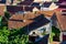 Overview of tile rooftops of old houses. Old buildings architecture