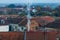 Overview of tile rooftops of old houses. Old buildings architecture