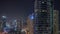 Overview to JBR and Dubai Marina skyline with modern high rise skyscrapers waterfront living apartments aerial night