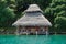 Overwater bungalow with thatch roof in Panama