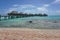 Overwater bungalows seen from sandy beach