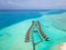 Overwater villas and white sand beach on tropical island for holidays vacation travel and honeymoon. Luxury resort hotel in