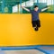 Overweight cute little boy jumping on trampoline indoors in a sport center for kids