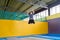 Overweight cute little boy jumping on trampoline indoors in a sport center for kids