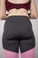 Overweight female buttocks in black leggings closeup, exercise for weight loss