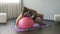 Overweight lady trying to train, funny attempts to lie on big fitness ball