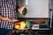 Overweight man blogger recording video in his kitchen