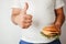 Overweight man with burger and thumb up