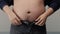 Overweight man closeup of belly