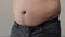 Overweight man closeup of belly