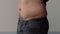 Overweight man closeup of belly