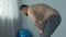 Overweight man feeling fatigue and breath disorder during home workout, dyspnea