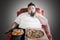 Overweight man with junk foods during watch TV