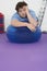Overweight Man Resting on Exercise Ball