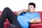 Overweight man sitting lazy on sofa 1