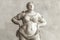 Overweight marble sculpture. Statue of a person with obesity, fat people, obesity, body size, dieting and nutrition, body