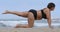 Overweight Mature caucasian woman doing exercise on yoga mat on beach, female alternately raises his legs up. Concept of