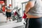 Overweight sweaty woman against mirror in gym