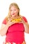 Overweight woman with bowl of chips and chocolate