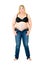 Overweight woman in a bra and unzipped jeans