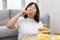 Overweight Woman Enjoy Eatting Fried Drumstick Chicken