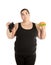 Overweight woman with hamburger and grapes