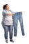 Overweight woman holding a pair of small jeans isolated on white