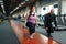 Overweight woman holds dumbbells, training in gym