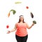 Overweight woman juggling with vegetables