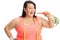 Overweight woman with a measuring tape having a carrot