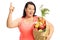 Overweight woman with a paper bag holding her finger up