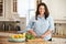 Overweight Woman Preparing Vegetables in Kitchen