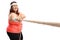 Overweight woman pulling a rope