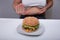 Overweight Woman Showing No Gesture To Hamburger