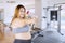Overweight woman shows thumb up in fitness center