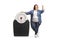 Overweight woman standing next to a medical scale and pointing up