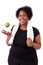 Overweight young black woman holding an apple - African people