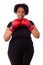 Overweight young black woman holding boxing gloves - African people