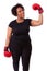 Overweight young black woman holding boxing gloves - African people