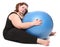 Overweight young woman with blue ball.