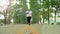 Overweight young woman jogging outdoors