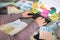 Overwhelmed woman working at messy office desk, closeup