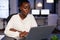 Overworked african american businesswoman reading business email