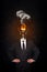 Overworked burnout business man standing headless with broken Bulb instead of his head. Symbolic Image - Stress Concept