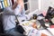 Overworked businessman sitting at a messy desk