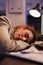 Overworked exhausted entrepreneur sleeping on desk table