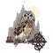 Owl sitting on an old key, on the background of the magic castle. A symbol of secret knowledge