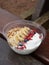owl with yogurt, banana, granola, blueberries and goji berries